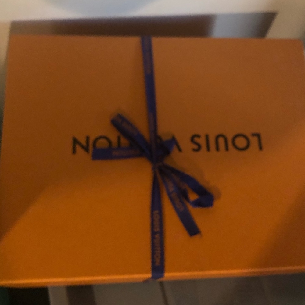 Pleothra if boxes. Gucci. Montclear. Valentino.  Louis Vuitton